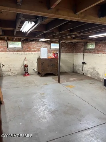 a view of an empty room with storage