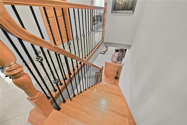 a view of staircase with rug