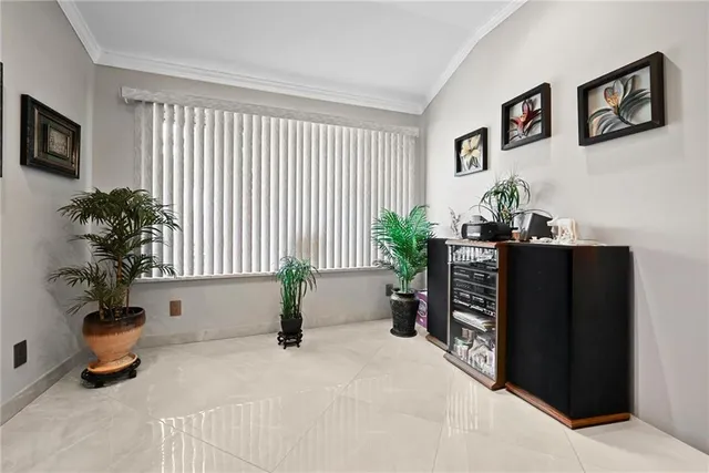a bedroom with furniture and a potted plant