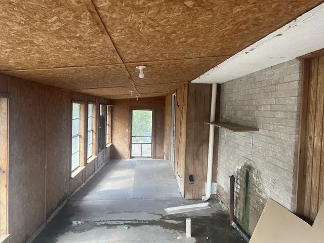 a view of outdoor space with sliding door and wooden floor