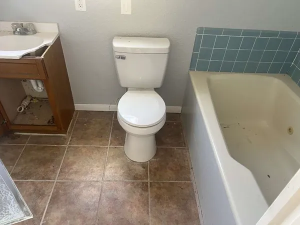 a bathroom with a toilet and a sink