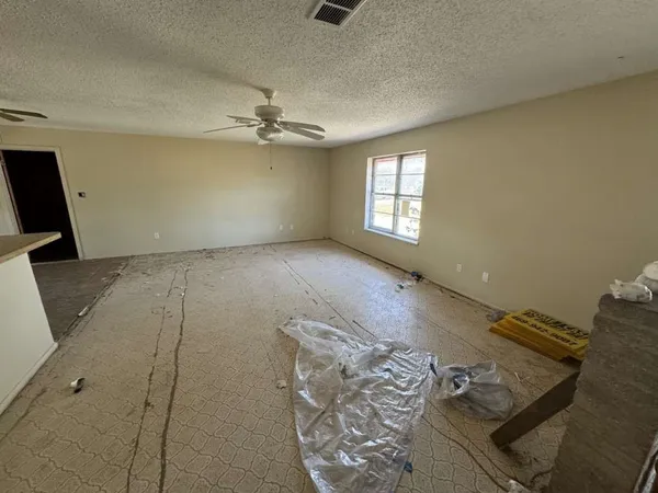 a view of a livingroom with a dishwasher furniture