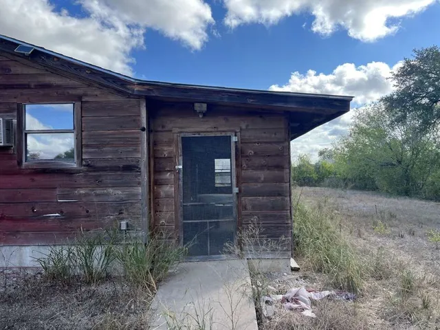 a view of a stone door of the house