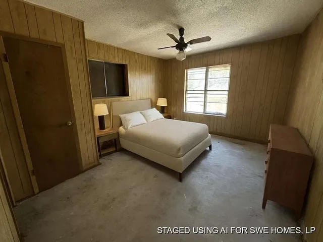 a bedroom with a bed and a dresser