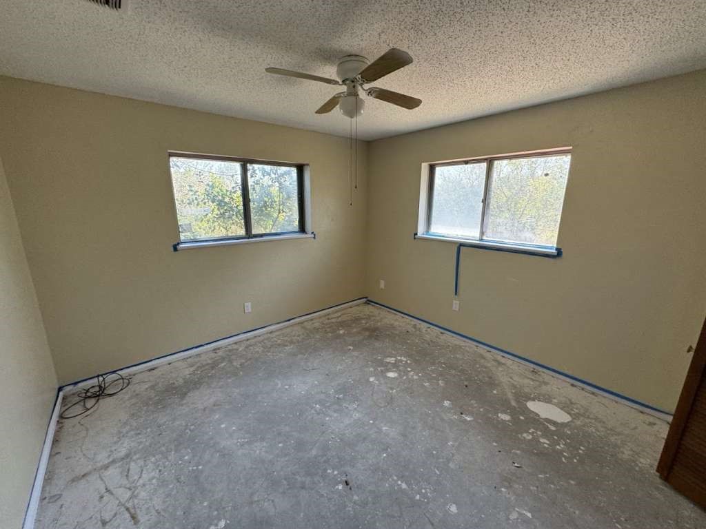 5996 Yucca Trail Beeville, TX 78102 - Photo 9 of 20 a view of an empty room with a window