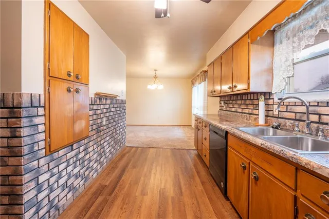 a kitchen with sink and cabinets