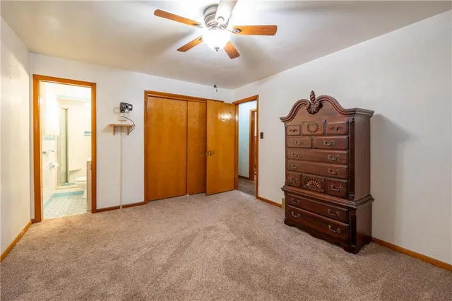 a view of room with a ceiling fan