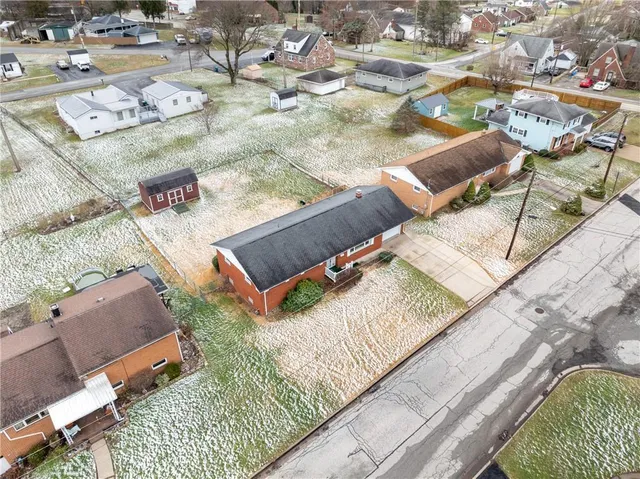 an aerial view of residential house with outdoor space