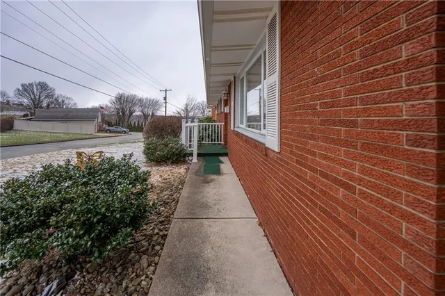 a view of a pathway both side of house