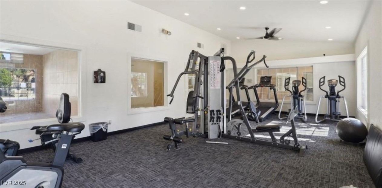 221 Mission Newport Lane, Unit 205 Las Vegas, NV 89107 - Photo 2 of 11 Gym featuring carpet flooring, lofted ceiling, recessed lighting, and a ceiling fan