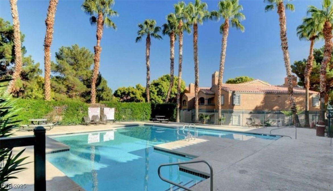 221 Mission Newport Lane, Unit 205 Las Vegas, NV 89107 - Photo 4 of 11 Community pool with a patio area