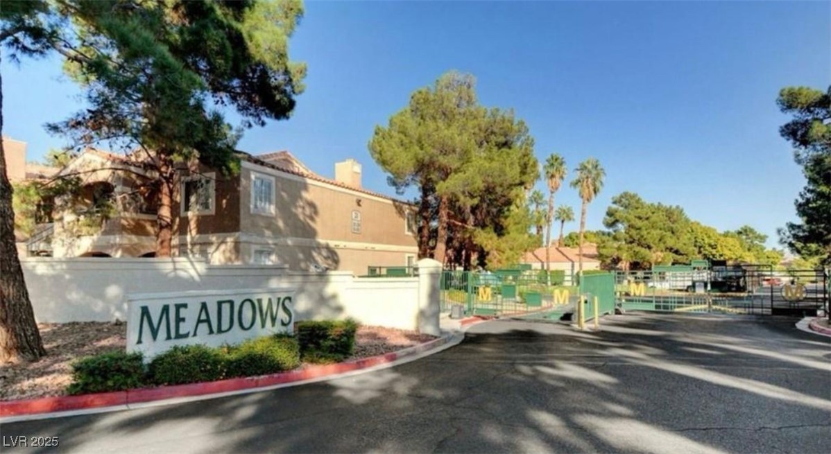 221 Mission Newport Lane, Unit 205 Las Vegas, NV 89107 - Photo 5 of 11 Community sign with a gate