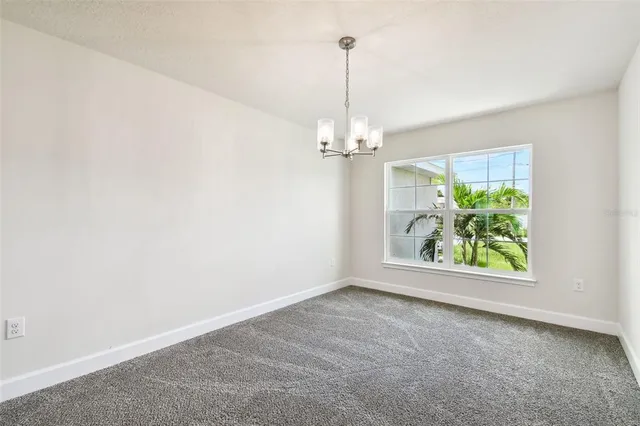 a view of an empty room with windows