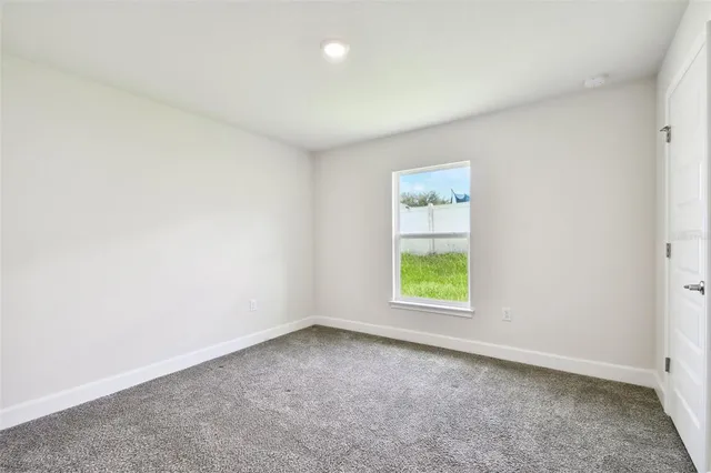 a view of storage and utility room with closet