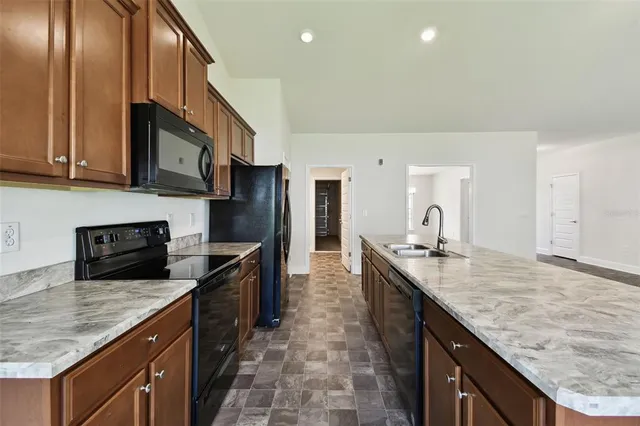 a kitchen with counter top space cabinets and a window