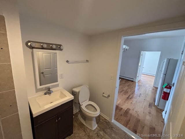 243 North Elm Street, Unit 3 Torrington, CT 06790 - Photo 5 of 7 a bathroom with a granite countertop sink toilet and shower