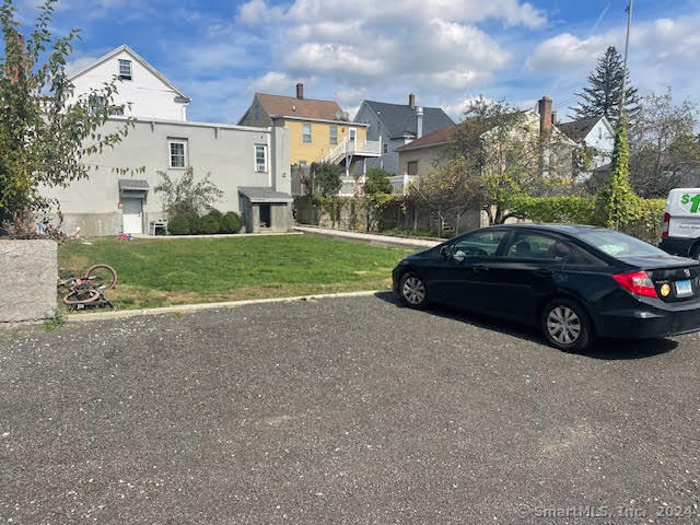 243 North Elm Street, Unit 3 Torrington, CT 06790 - Photo 7 of 7 a view of a car parked in front of a house