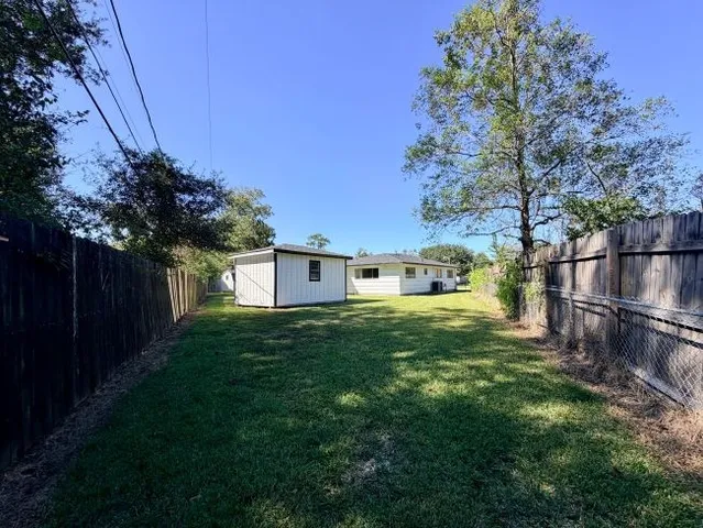 a view of backyard with green space