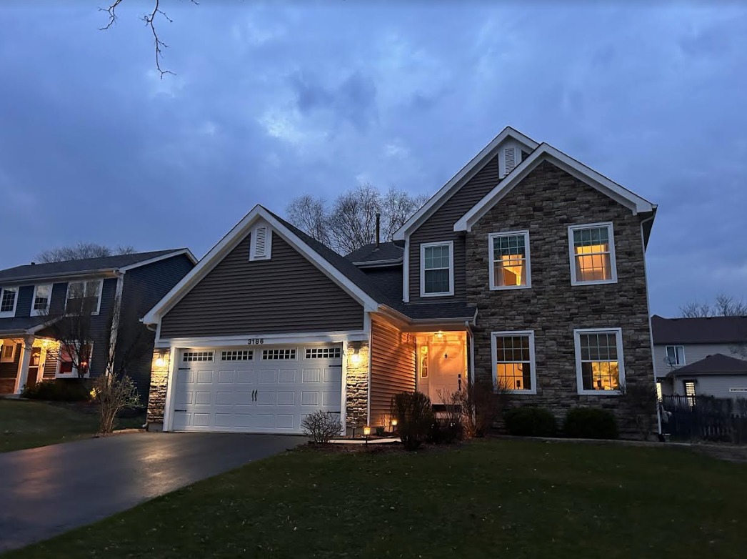 3186 Whitney Road Aurora, IL 60502 - Photo 1 of 1 a front view of a house with a yard