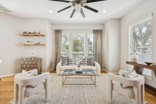 a living room with furniture and a large window