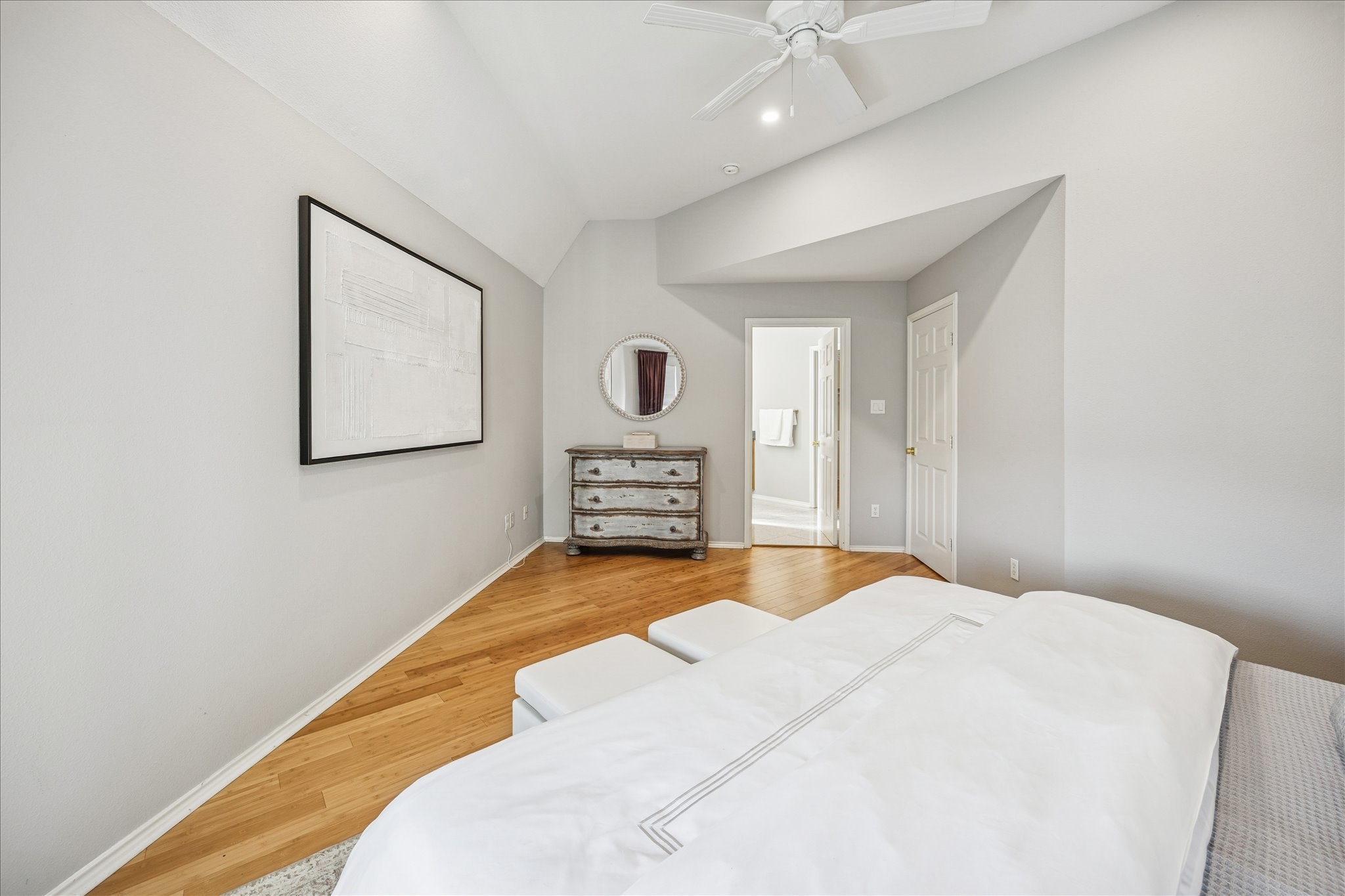 2607 Link Road Houston, TX 77009 - Photo 15 of 21 Bright third floor Primary Suite with hardwood flooring, a vaulted ceiling with a fan, and a neutral color palette.