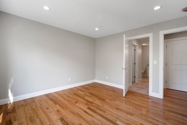 4 Sabrina Way, Unit G Feeding Hills, MA 01030 - Photo 11 of 16 a view of empty room with wooden floor