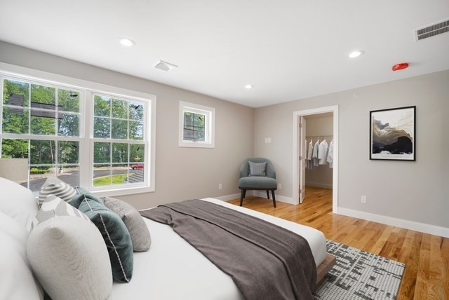 4 Sabrina Way, Unit G Feeding Hills, MA 01030 - Photo 13 of 16 a bedroom with a bed and a large window