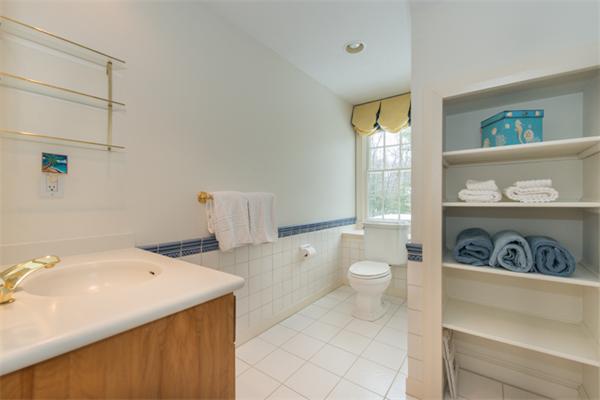 123 High Ridge Road Boxford, MA 01921 - Photo 24 of 29 a bathroom with a sink a toilet and a window