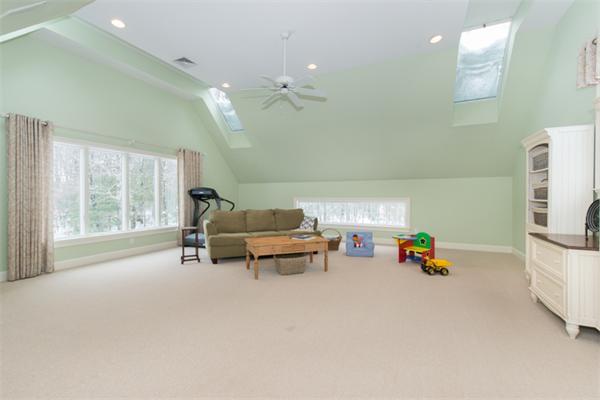 123 High Ridge Road Boxford, MA 01921 - Photo 28 of 29 a living room with furniture and a chandelier