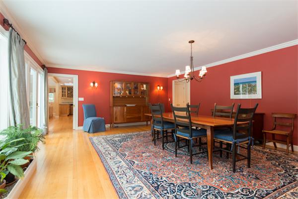 123 High Ridge Road Boxford, MA 01921 - Photo 9 of 29 a dining room with furniture a rug and a chandelier