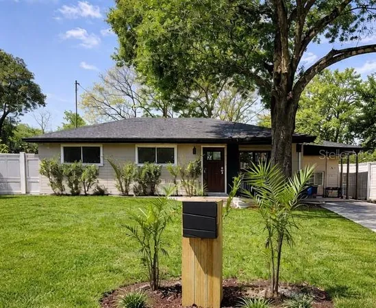 a front view of house with yard having outdoor seating