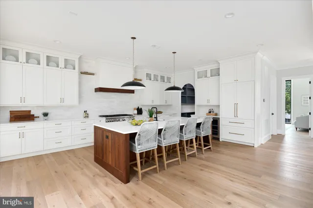 a living room with furniture and large windows