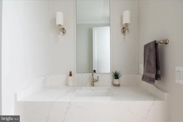 a bedroom with a large bed and a large window