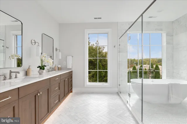 a view of room window and a ceiling fan