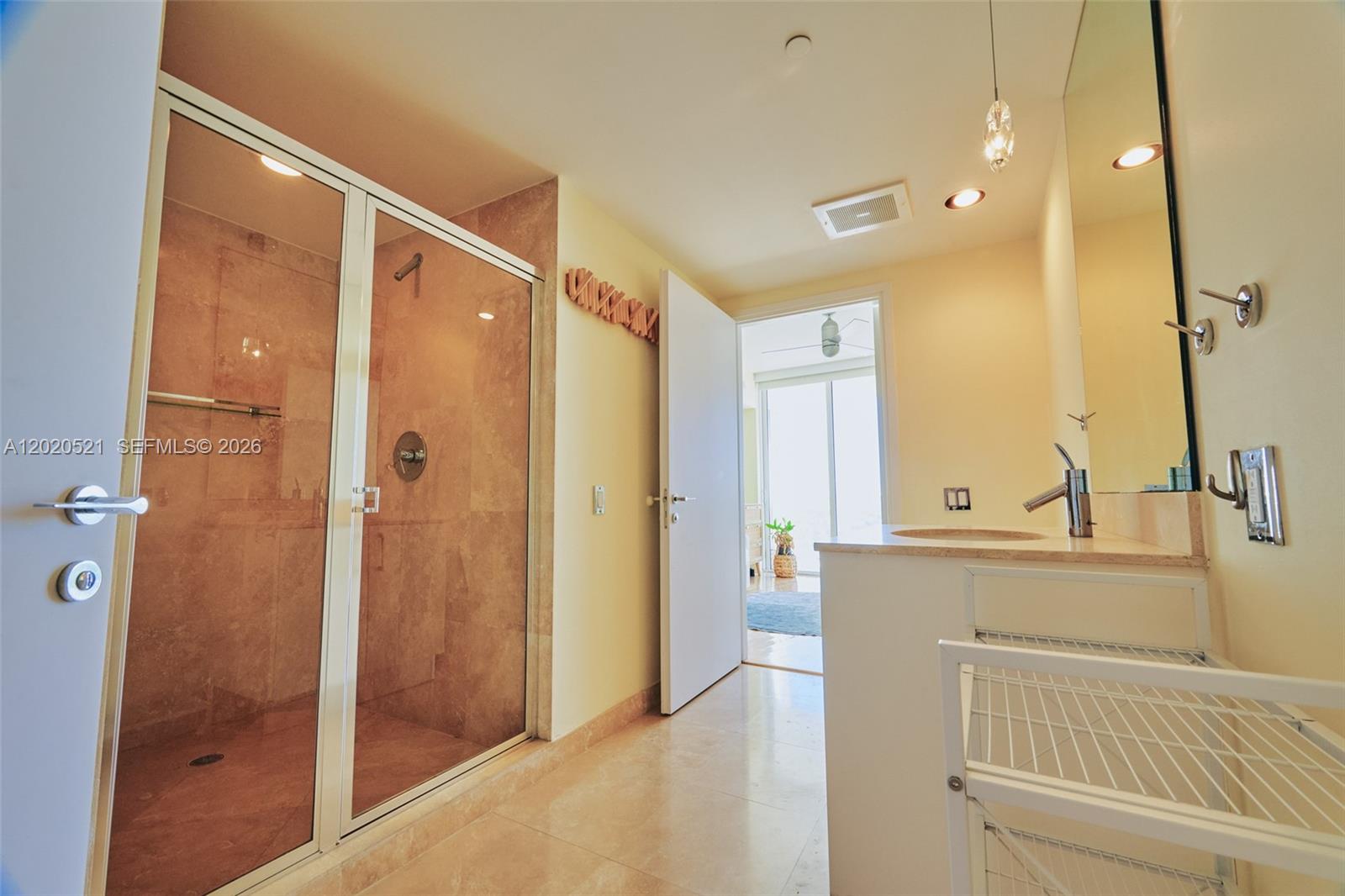 450 Alton Road, Unit 2810 Miami Beach, FL 33139 - Photo 17 of 29 a bathroom with a shower and a sink