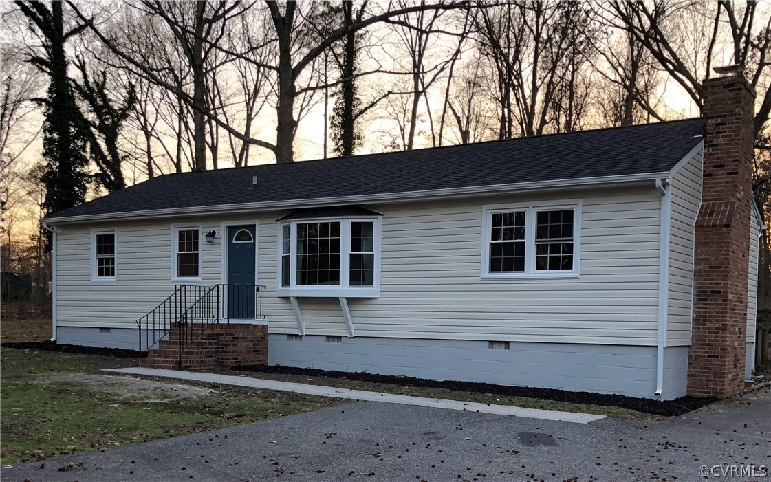 12518 South Chester Road Chester, VA 23831 - Photo 1 of 27 a front view of a house with a yard