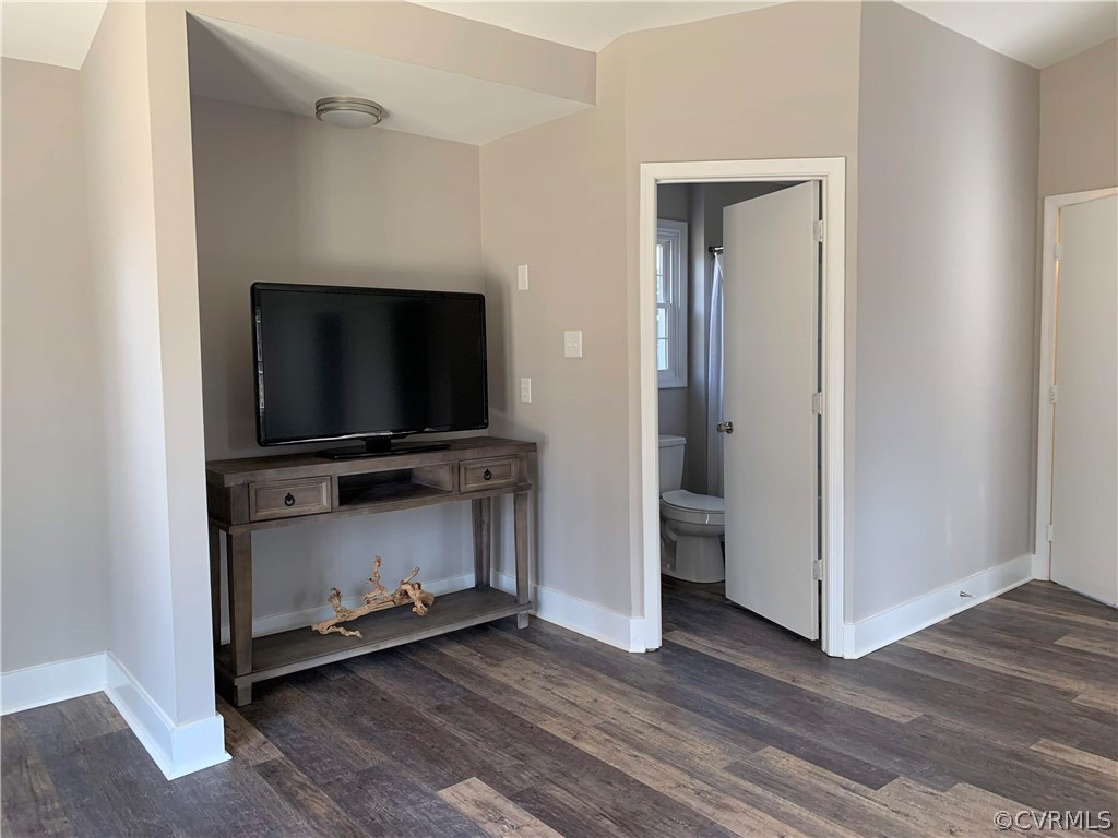 12518 South Chester Road Chester, VA 23831 - Photo 15 of 27 a living room with wooden floor and flat screen tv