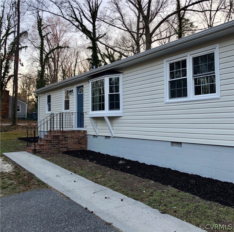 12518 South Chester Road Chester, VA 23831 - Photo 3 of 27 a front view of a house with a yard