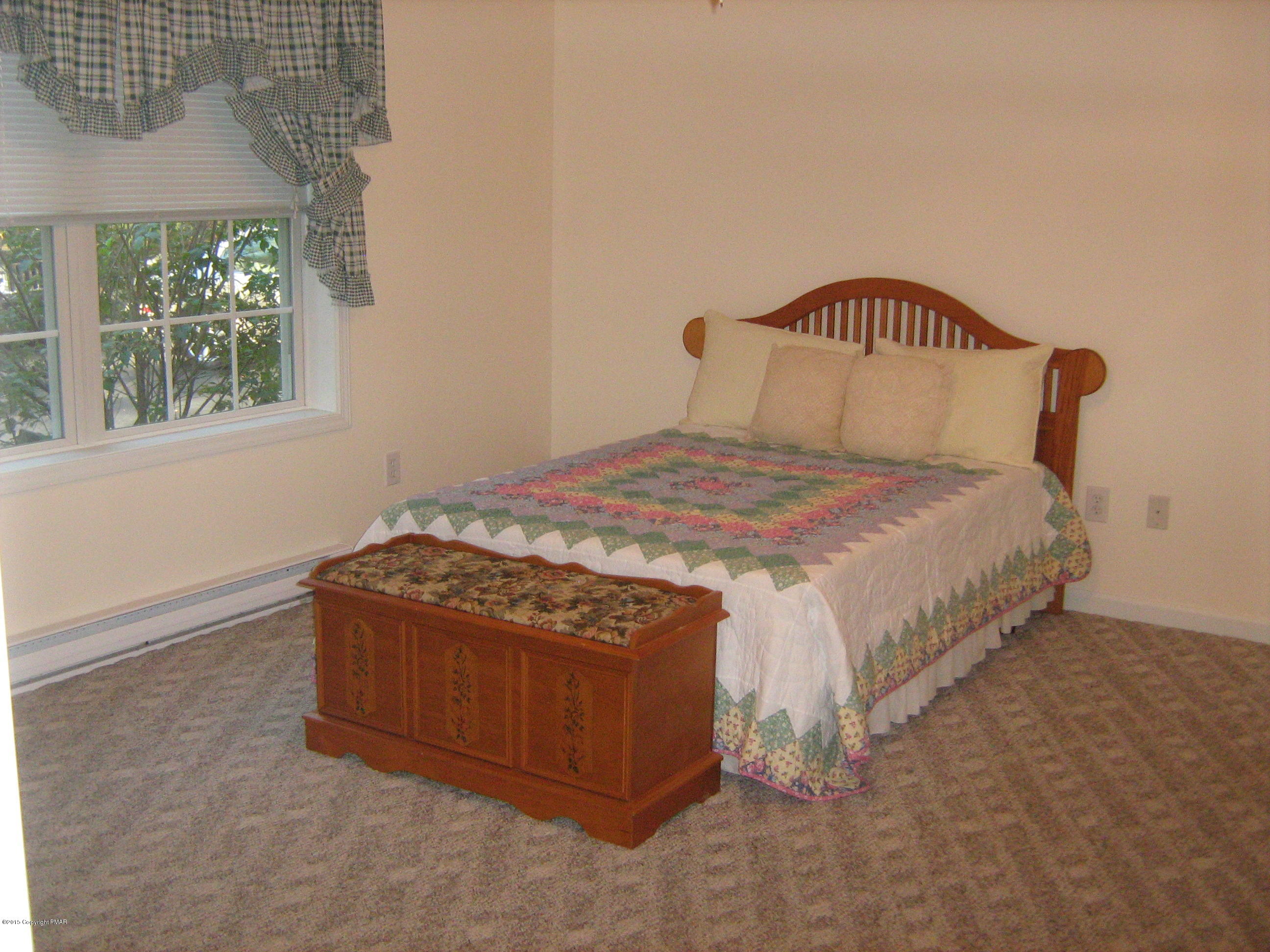 118 Bromley Road Henryville, PA 18332 - Photo 15 of 37 a bedroom with a bed and window