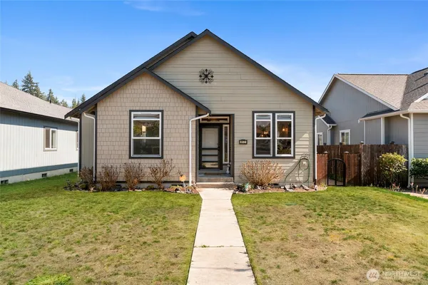 a front view of a house with a yard
