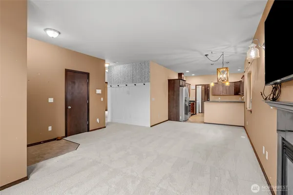 a view of a livingroom with a kitchen