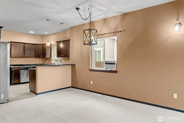 a view of a kitchen with electric appliances