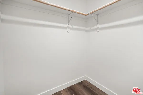 a view of an empty walk in closet