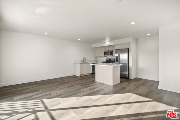 a view of kitchen with wooden floor