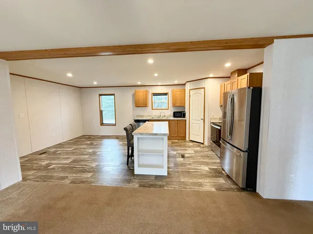 a bathroom with a sink and stainless steel appliances