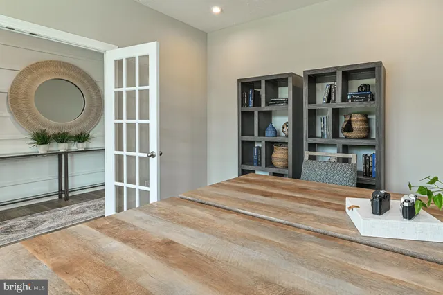 a bedroom with a bed a window and lamp