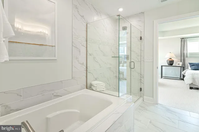 a spacious bedroom with a bed and a window