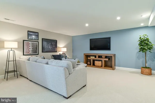 a view of a dining room with furniture and a potted plant