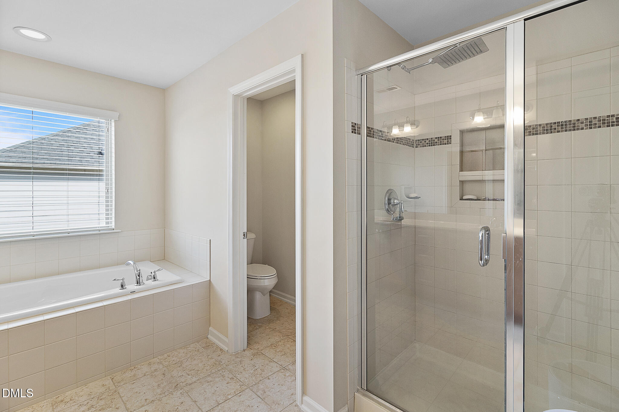 4249 Saubranch Hill Street Raleigh, NC 27616 - Photo 23 of 31 a bathroom with a bathtub shower and toilet