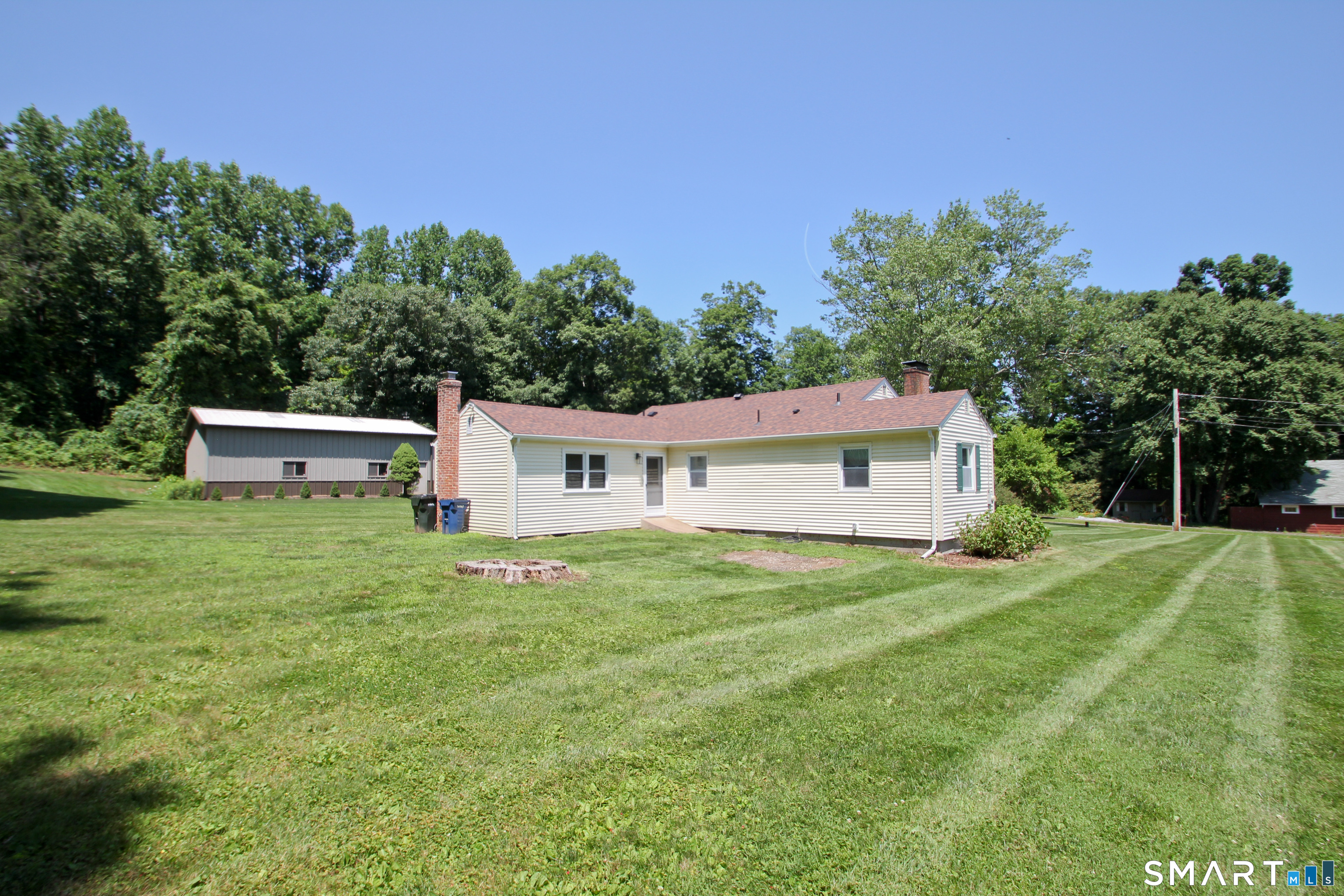 5 R Broad Hill Road Granby, CT 06090 - Photo 23 of 31 a house view with a garden space